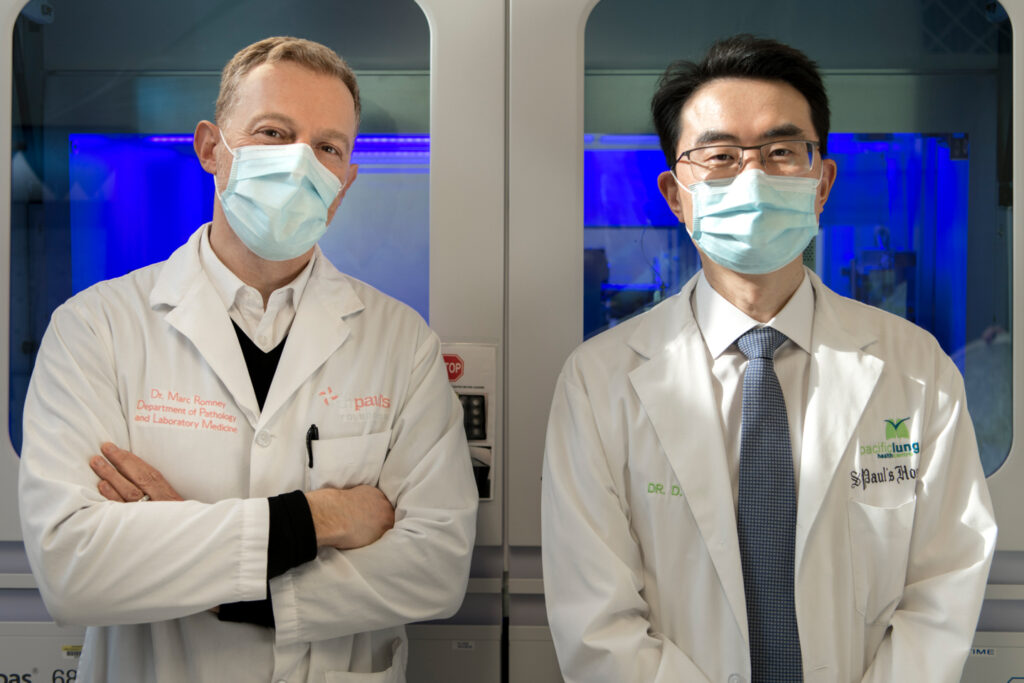 Image of Two doctors wearing masks standing side-by-side