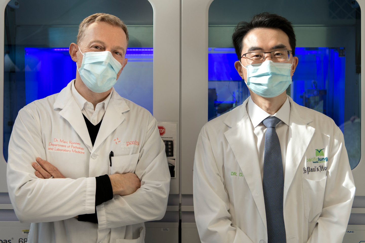 Image of Two doctors wearing masks standing side-by-side
