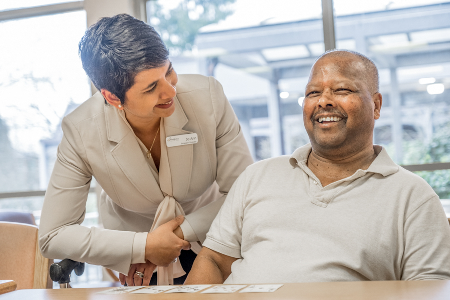 Image of Jo-Ann Tait with Youville resident Suseesh.