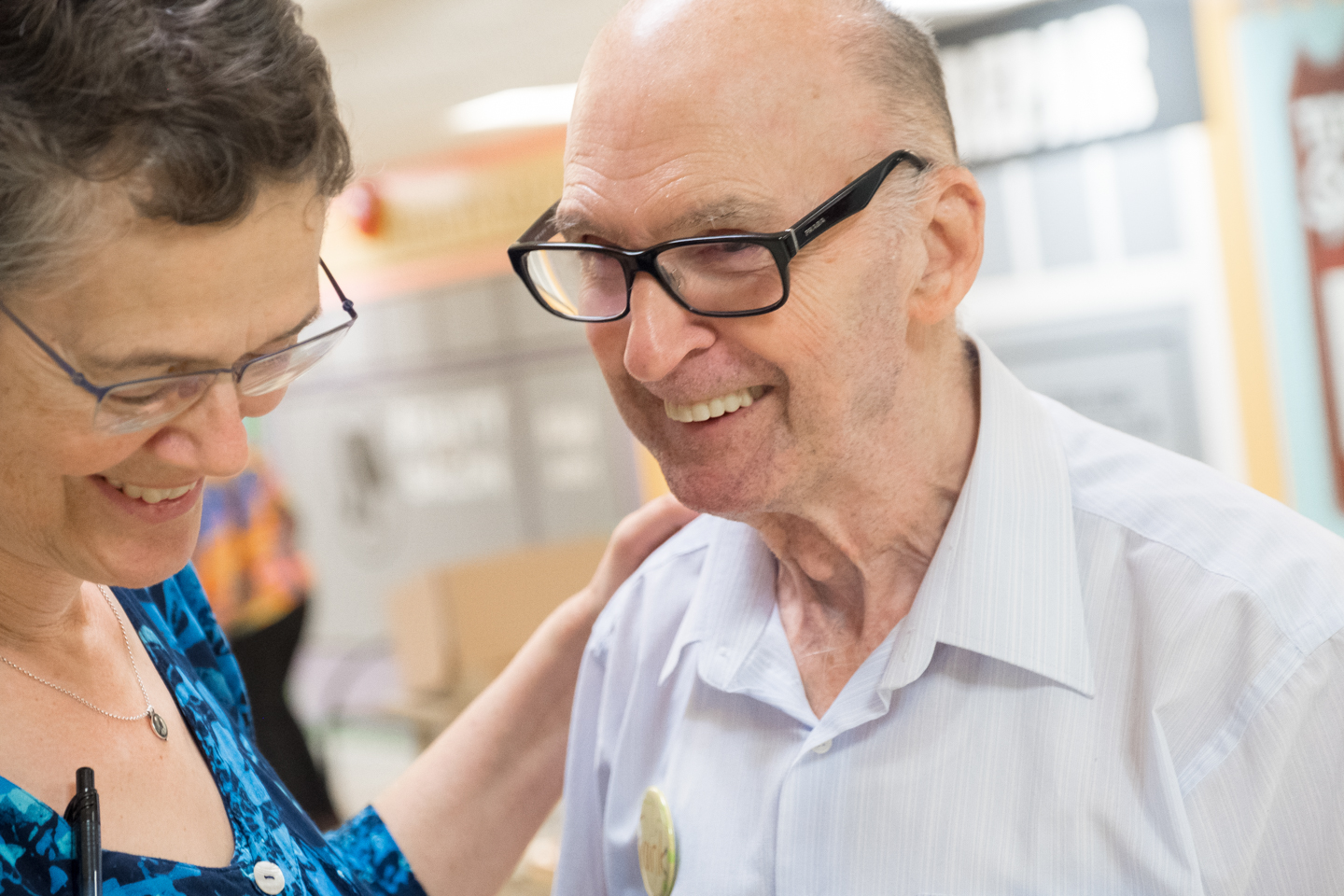 Image of Frank, attendee of Youville's Adult Day program, smiles during music therapy.