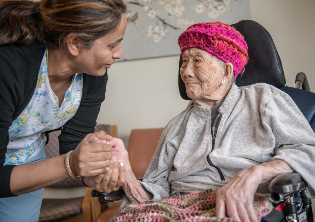 Image of A PHC Staff Member and Seniors