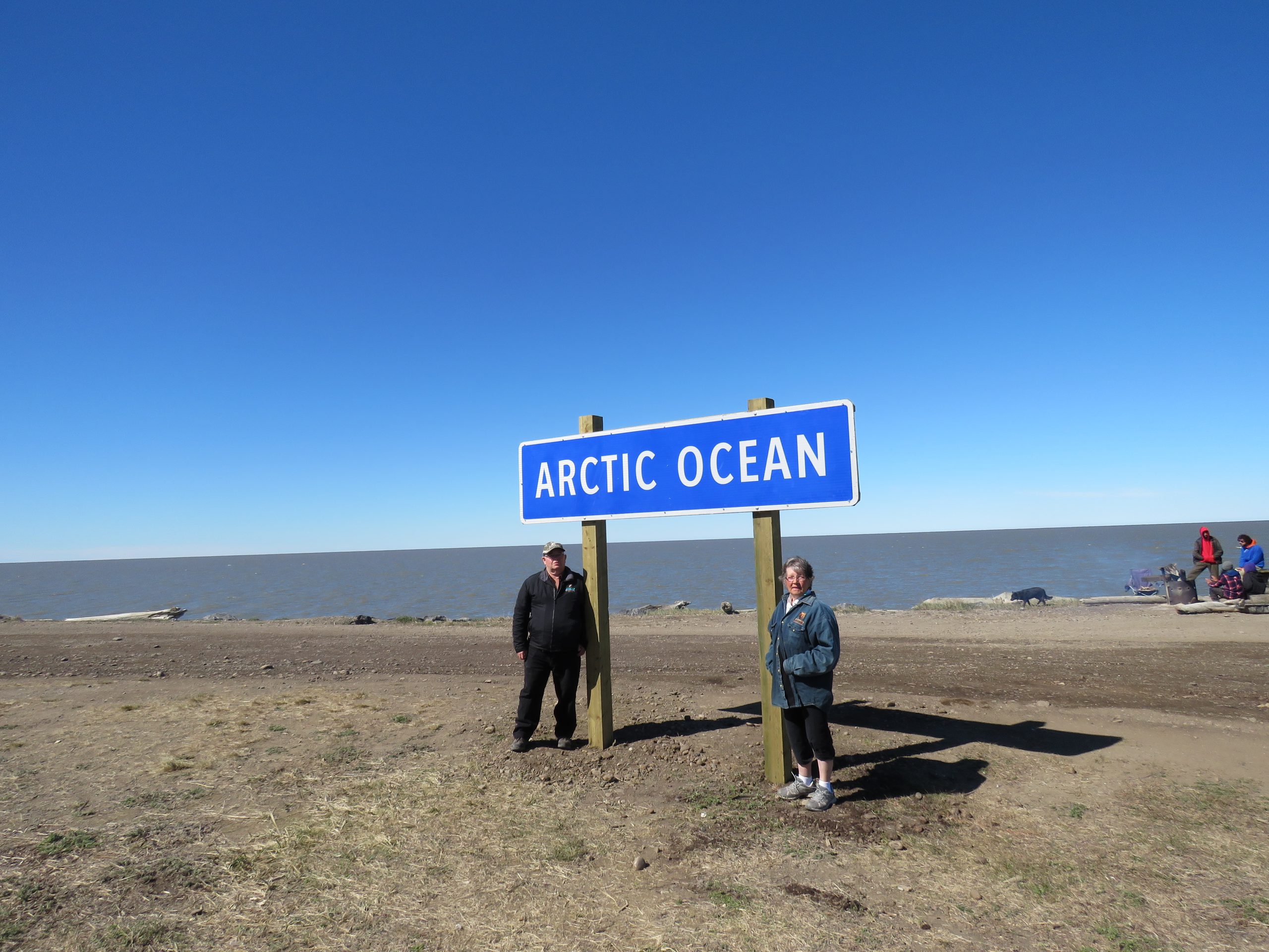 Image of Irma and David Oliver at an Arctic Ocean sign