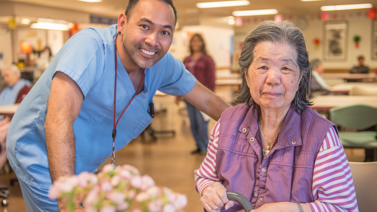 A caregiver and senior resident.